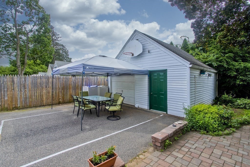 94 Gillette Avenue Springfield, MA 01118 - Photo 3 of 31 a backyard of a house with yard barbeque oven and outdoor seating