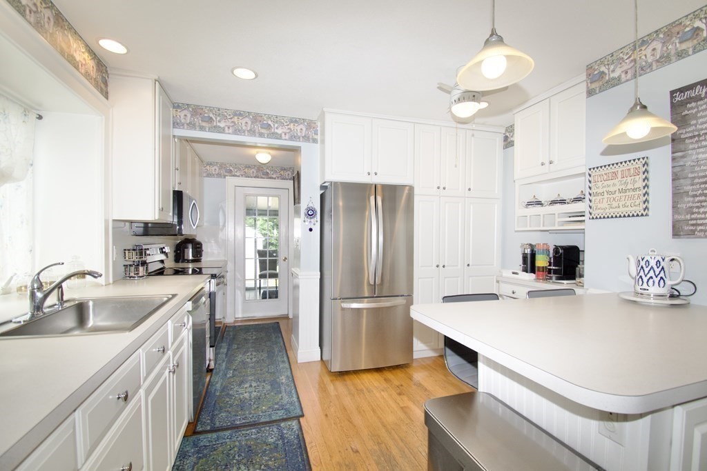 94 Gillette Avenue Springfield, MA 01118 - Photo 7 of 31 a kitchen with stainless steel appliances a sink stove and refrigerator