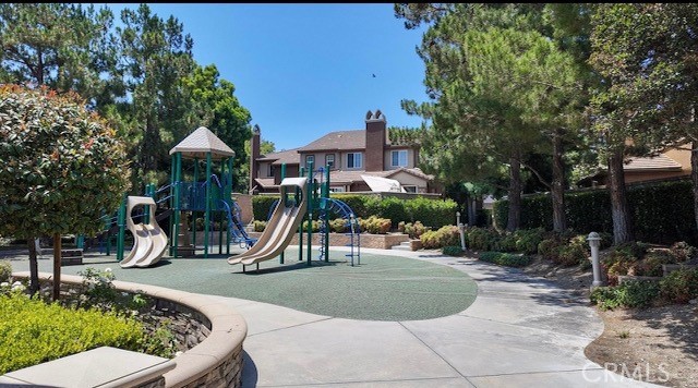 8692 East 9th Street, Unit 56 Rancho Cucamonga, CA 91730 - Photo 31 of 34 a view of a park with swings and slides