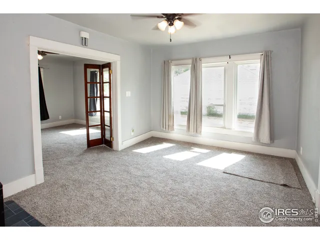 a kitchen with a refrigerator and a sink