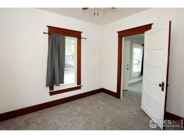 a view of an empty room and closet