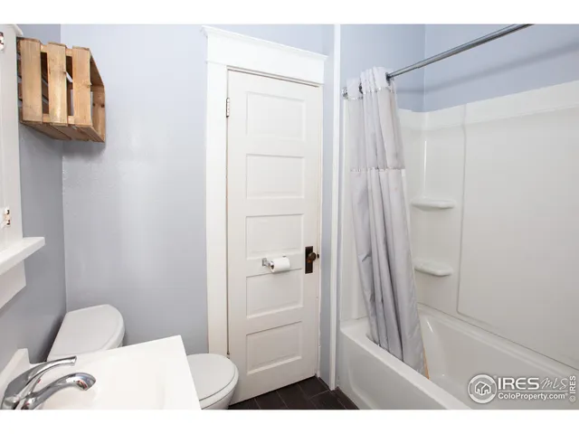 a view of a room with a table and a chair