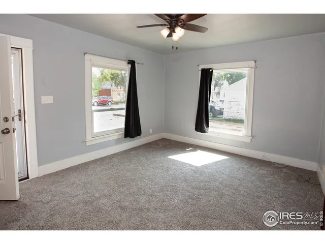 a view of empty room with windows