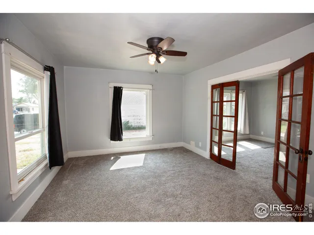 a view of livingroom with hardwood floor and a ceiling fan