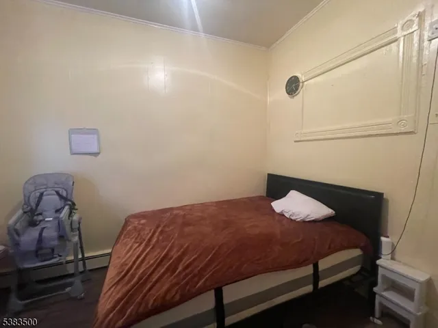a bedroom with a bed and cabinets