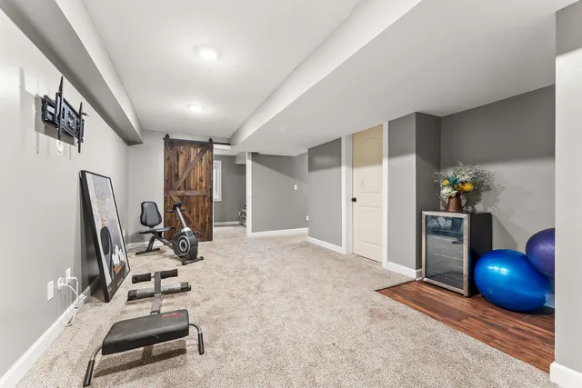 a view of a livingroom with furniture and a window