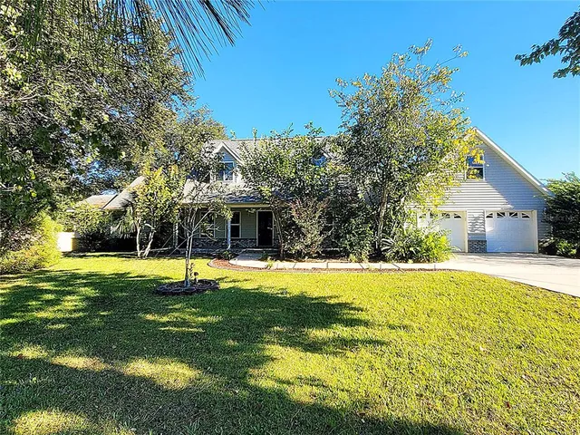 a living room with furniture a rug and a chandelier