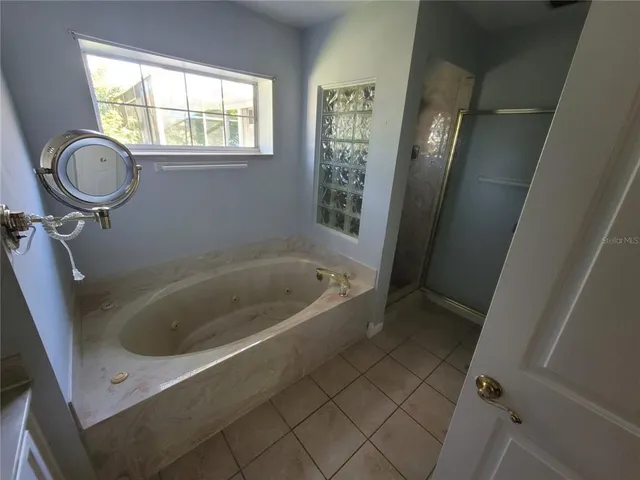 a view of an outdoor space and basketball court