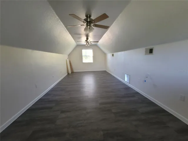 a bath tub sitting next to a white sink