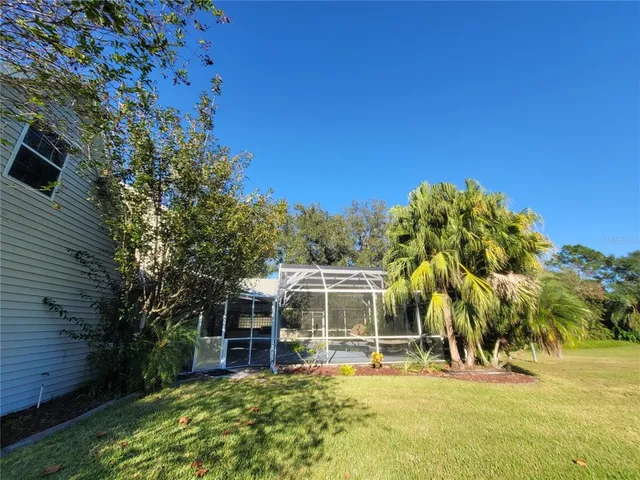 an aerial view of a house with a yard lake view
