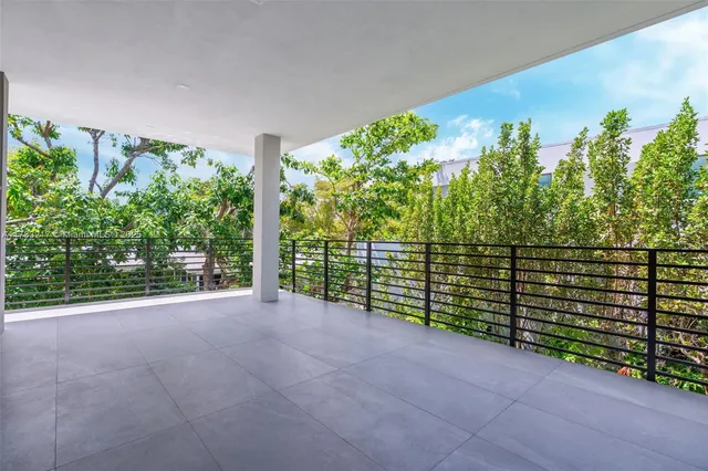 a view of a room that has a large window