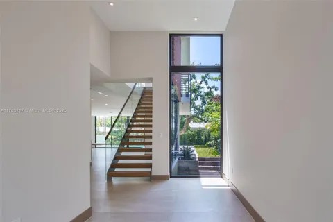 a view of room with furniture and stairs