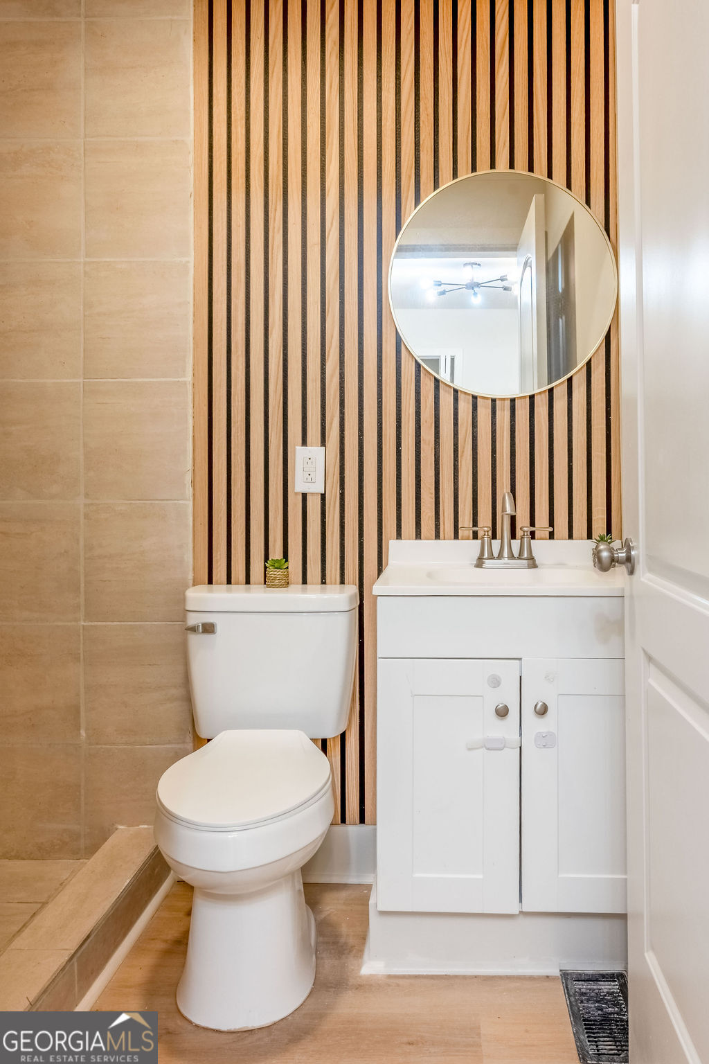 80 Menefee Street Palmetto, GA 30268 - Photo 17 of 30 a bathroom with a toilet and a sink