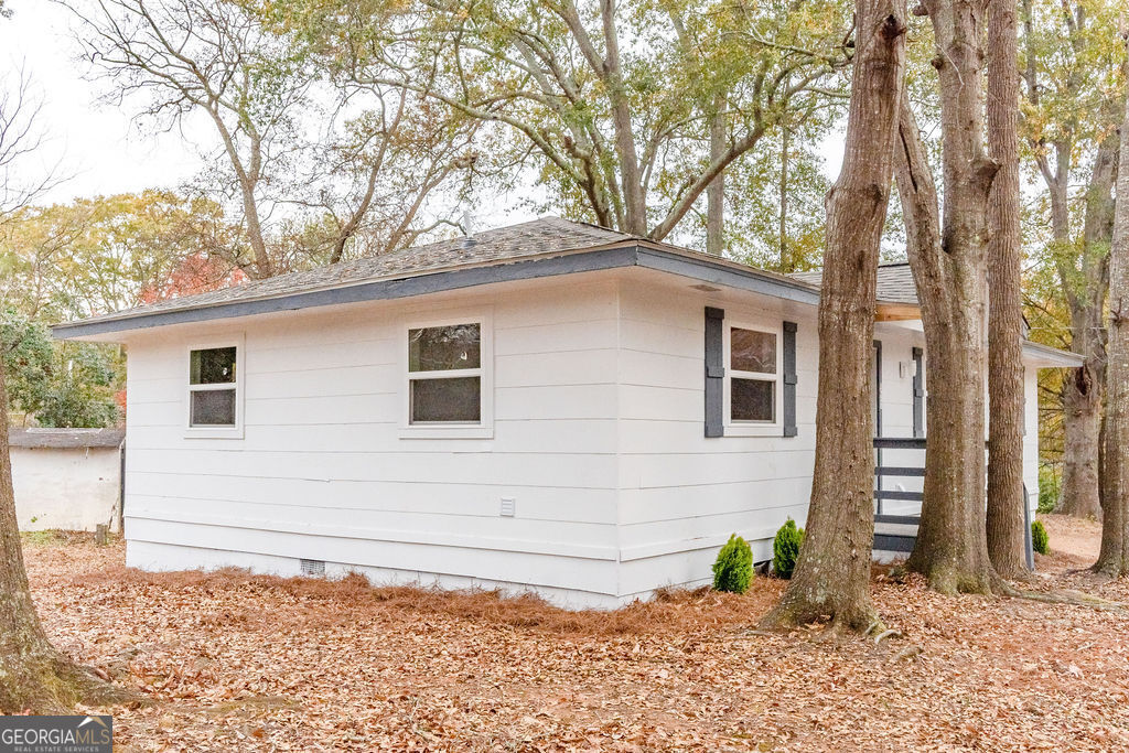 80 Menefee Street Palmetto, GA 30268 - Photo 28 of 30 a backyard of a house with lots of green space