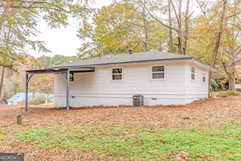 80 Menefee Street Palmetto, GA 30268 - Photo 29 of 30 a house with trees in the background