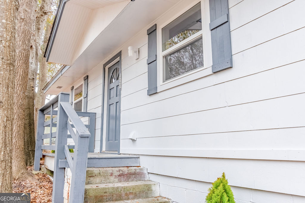 80 Menefee Street Palmetto, GA 30268 - Photo 4 of 30 a view of staircase with black and white walls