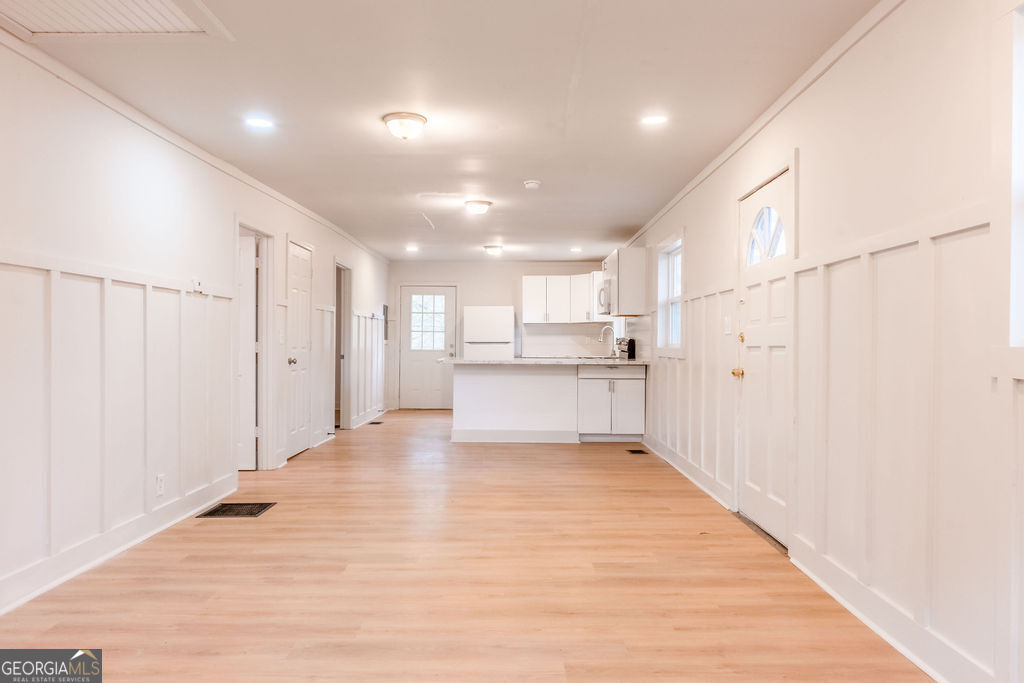 80 Menefee Street Palmetto, GA 30268 - Photo 7 of 30 a view of a kitchen with wooden floor