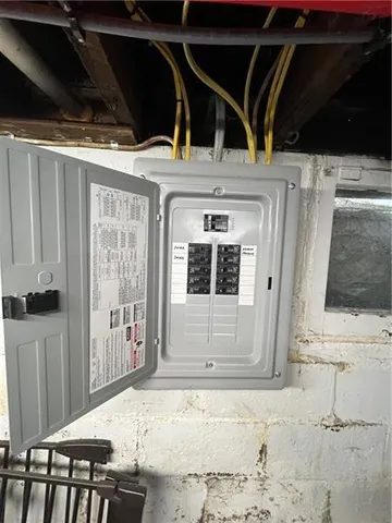 a view of a house with wooden fence