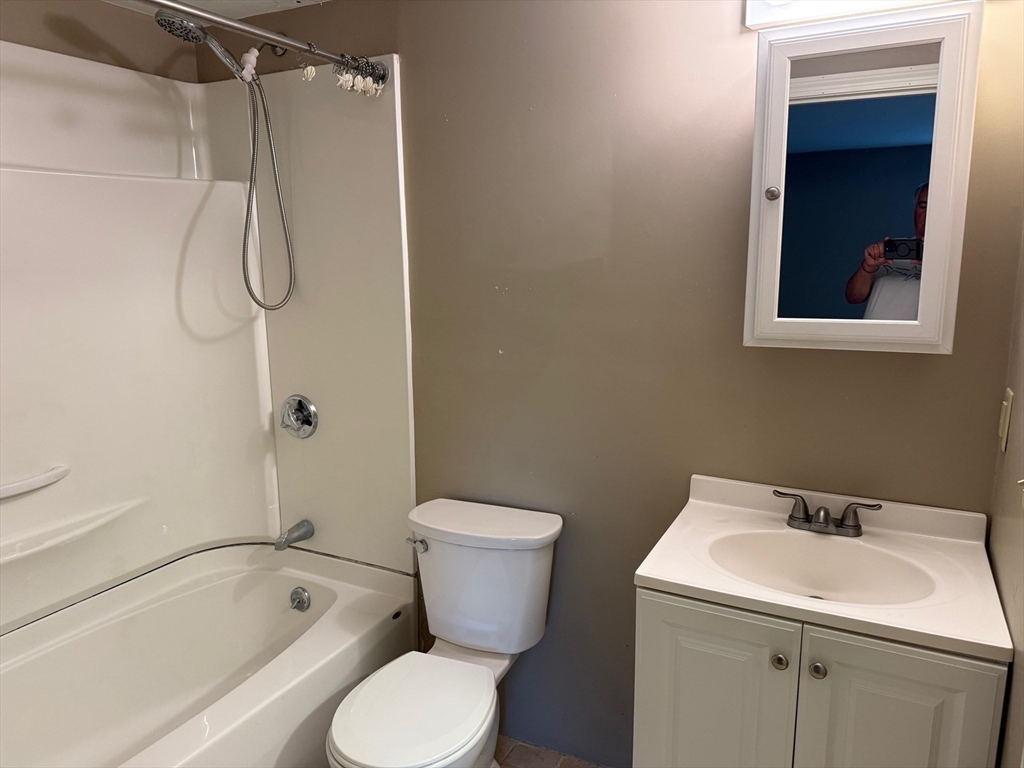 26 Parsonage Street, Unit 5 Marshfield, MA 02050 - Photo 4 of 4 a bathroom with a sink toilet and shower