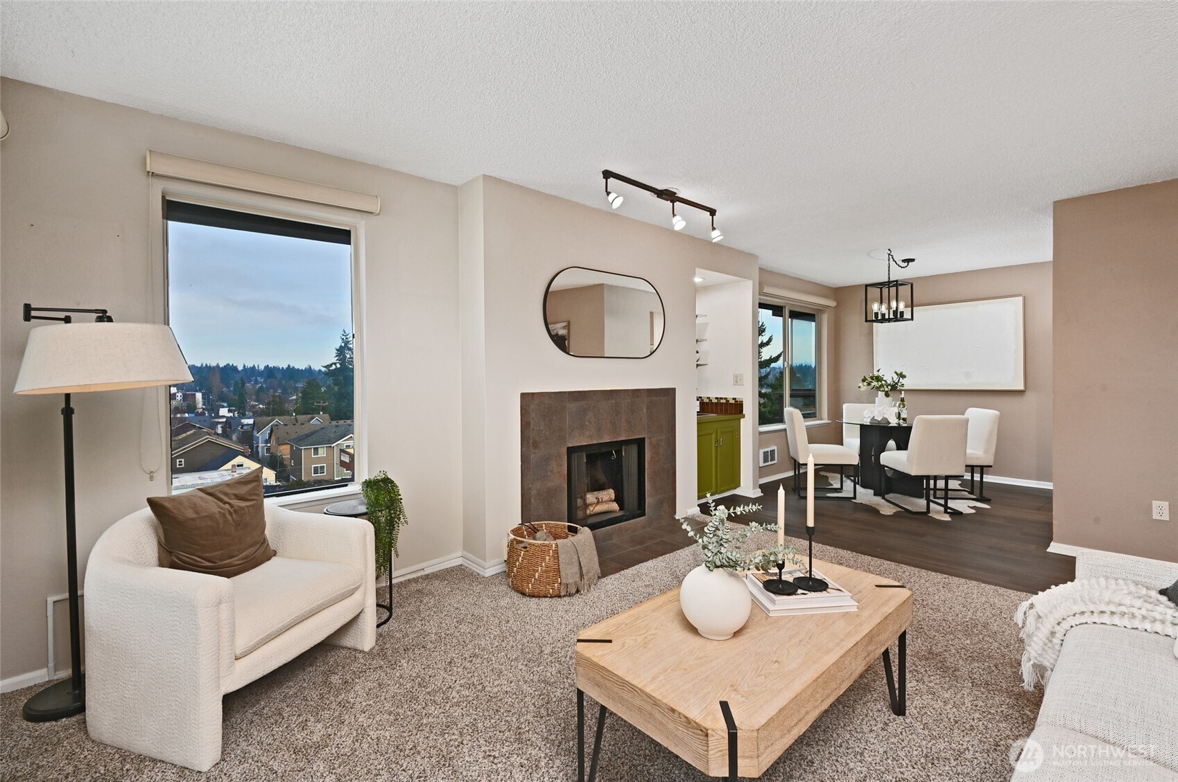 3421 Southwest Roxbury Street, Unit 401 Seattle, WA 98126 - Photo 3 of 22 a living room with furniture and a fireplace