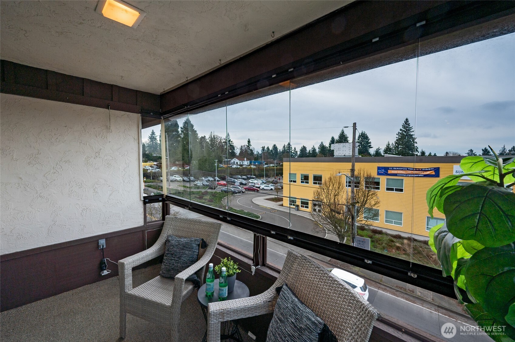 3421 Southwest Roxbury Street, Unit 401 Seattle, WA 98126 - Photo 4 of 22 a sitting area with furniture and outside view