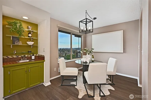 a view of a dining room with furniture window and wooden floor