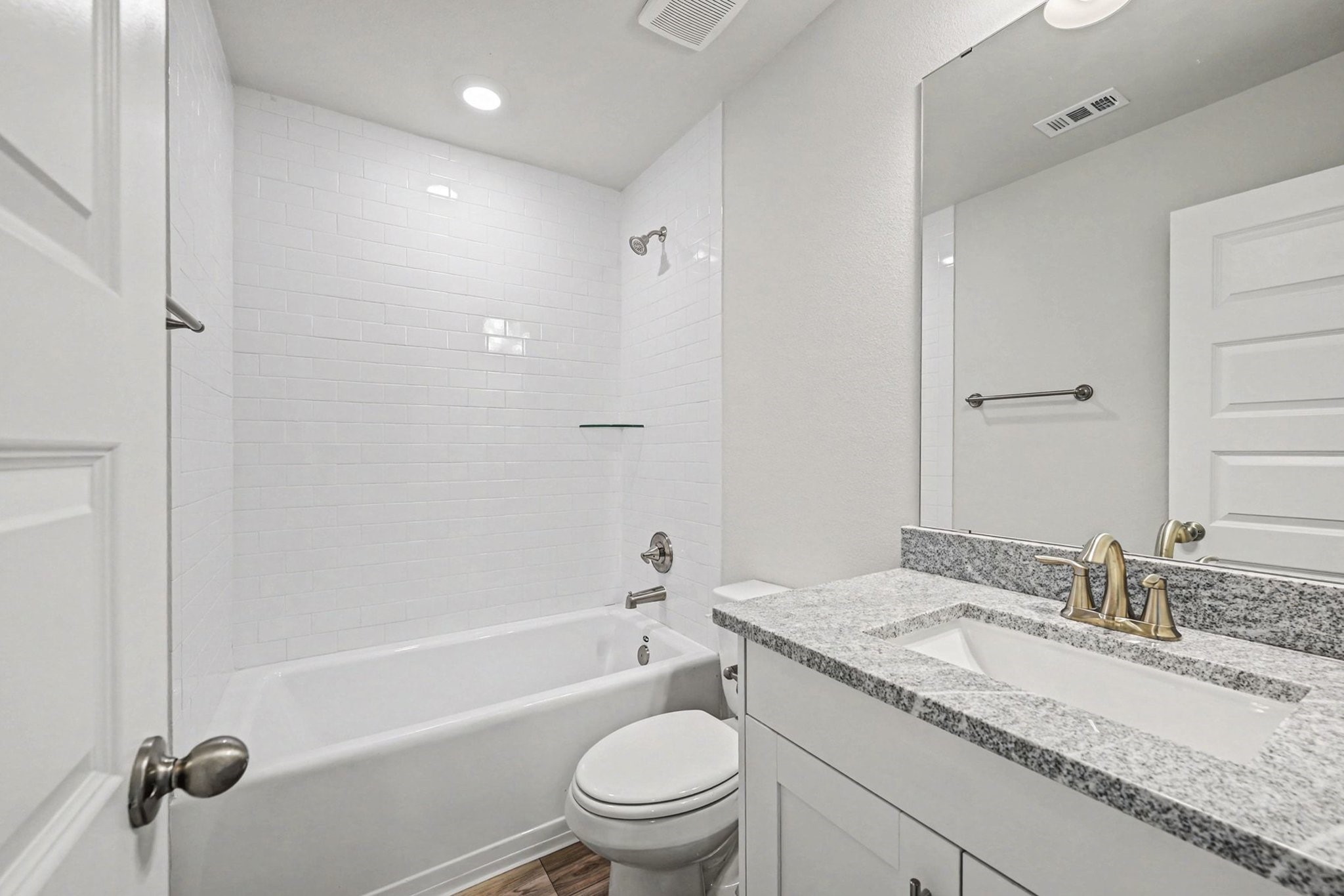 601 Greystone Lane Angleton, TX 77515 - Photo 16 of 32 a bathroom with a granite countertop sink a toilet and shower