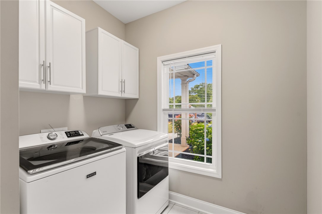 1411 Dunn Road Anderson, SC 29625 - Photo 15 of 30 Bright laundry room with convenient built-in cabinetry provides ample storage for household essentials.