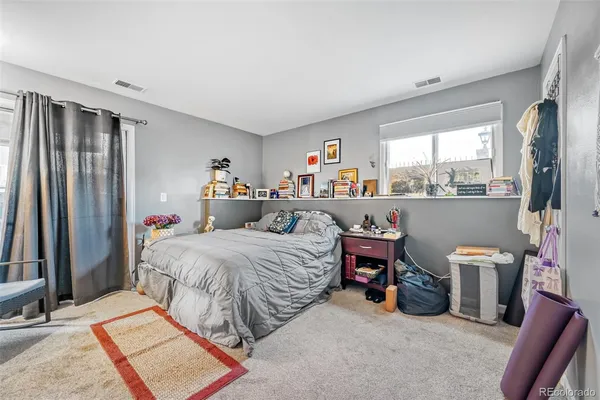 a bed room with a bed and a window