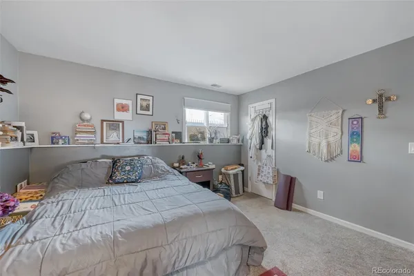 a bedroom with a large bed and a table
