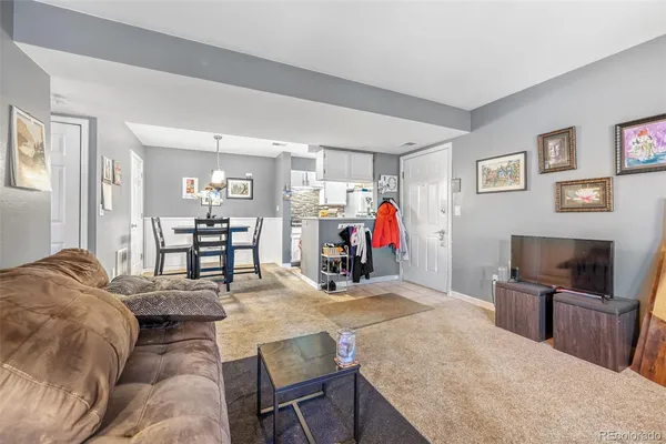 a bed room with furniture and a flat screen tv