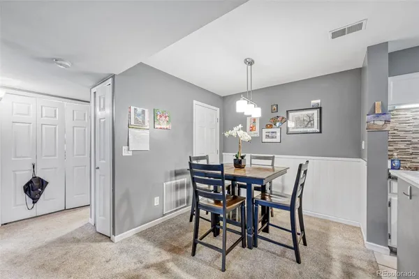a view of a dining room with furniture
