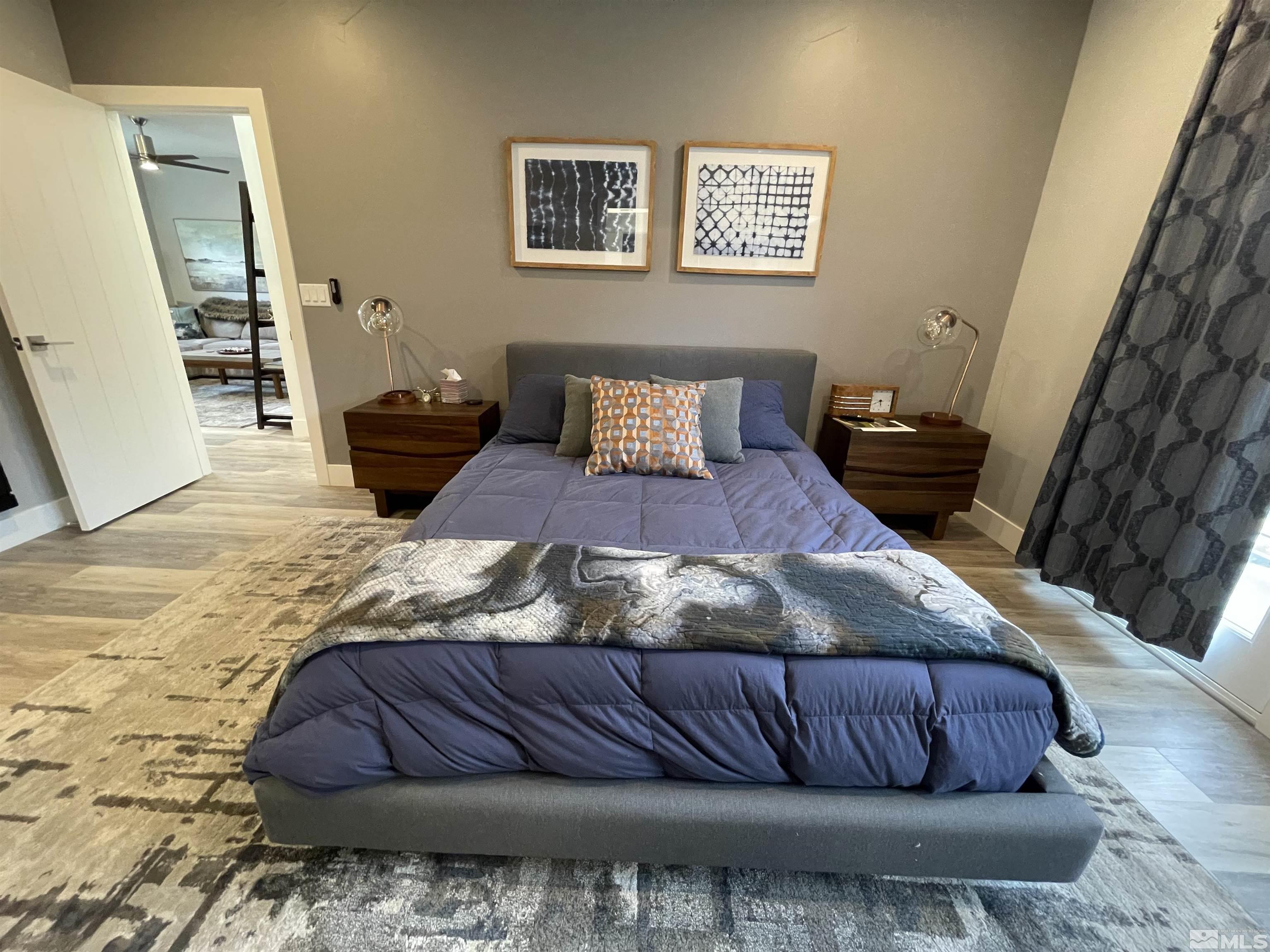 123 Martin Street Reno, NV 89509 - Photo 16 of 31 a bedroom with a bed and a couch