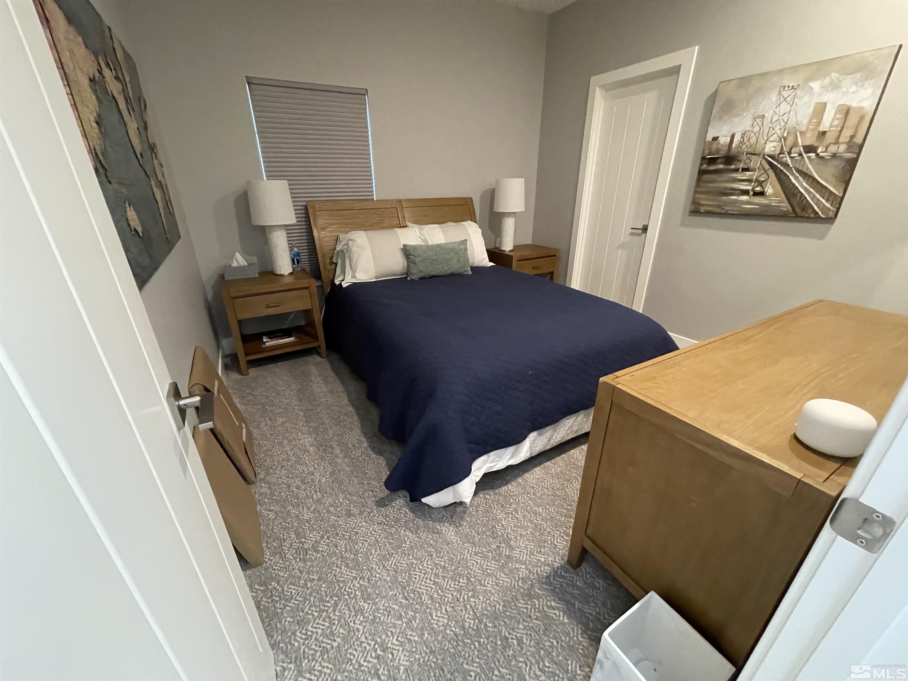 123 Martin Street Reno, NV 89509 - Photo 22 of 31 a bedroom with a bed and furniture