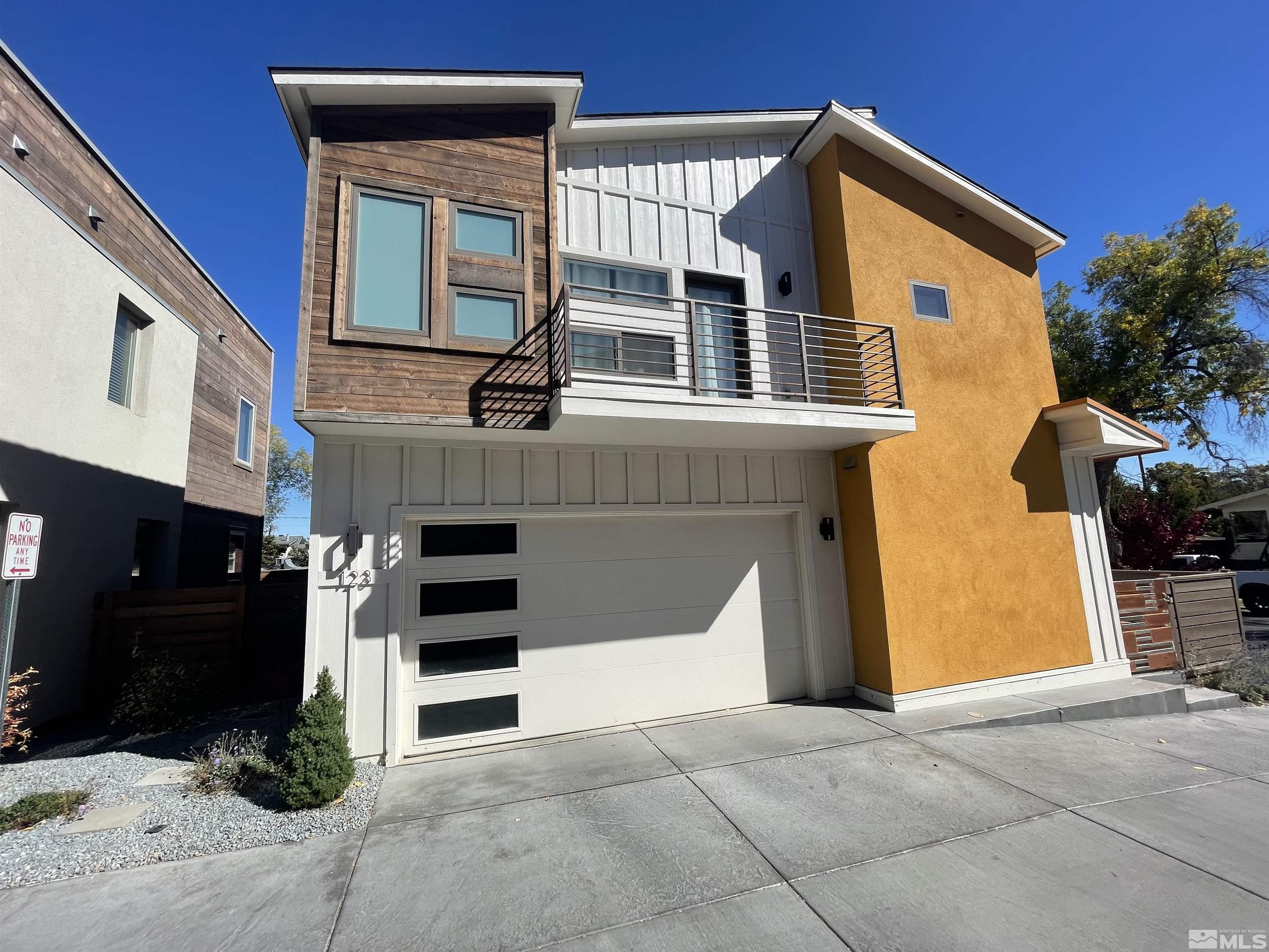 123 Martin Street Reno, NV 89509 - Photo 4 of 31 a front view of a house with garage