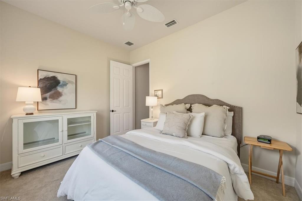 13466 Sumter Lane Naples, FL 34109 - Photo 17 of 36 Bedroom with light carpet and a ceiling fan
