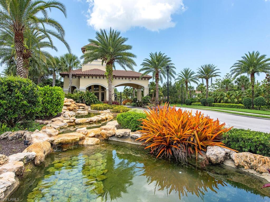 13466 Sumter Lane Naples, FL 34109 - Photo 29 of 36 Surrounding community with a small pond