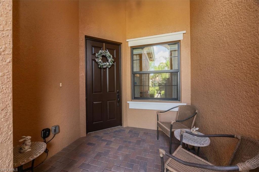 13466 Sumter Lane Naples, FL 34109 - Photo 4 of 36 Property entrance with stucco siding