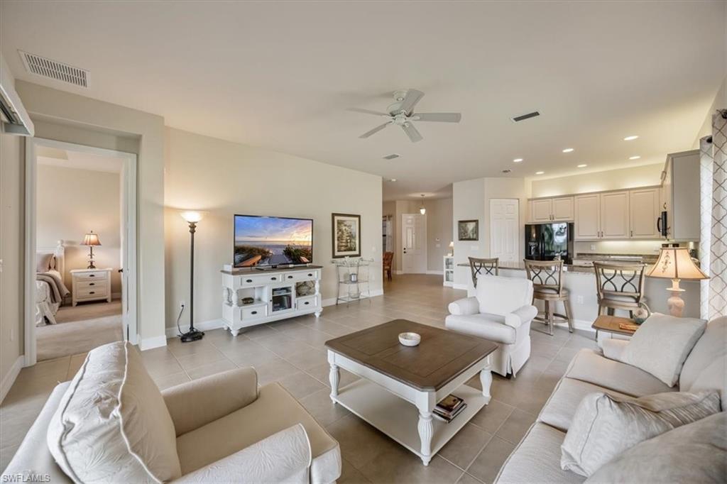 13466 Sumter Lane Naples, FL 34109 - Photo 5 of 36 Living room featuring recessed lighting, light tile patterned flooring, and ceiling fan