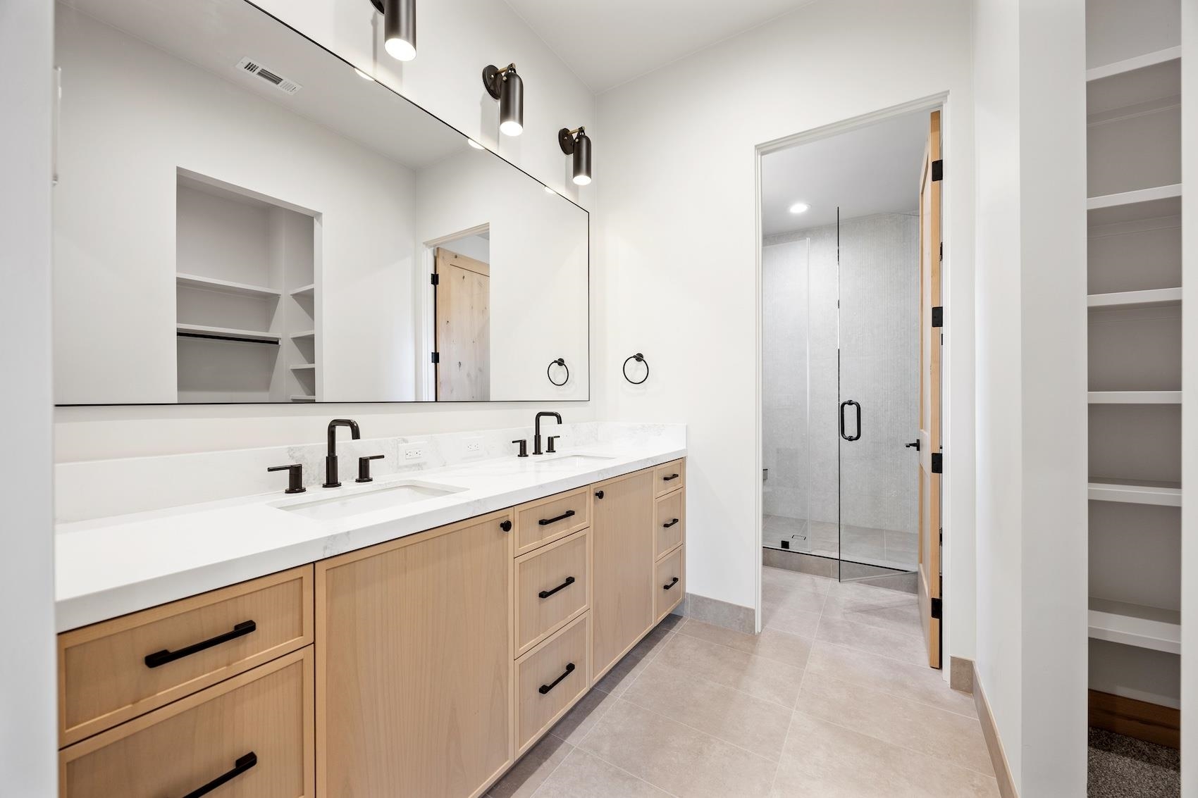 7350 Cascade Road Soda Springs, CA 95728 - Photo 13 of 27 a spacious bathroom with a double vanity sink a mirror and a
