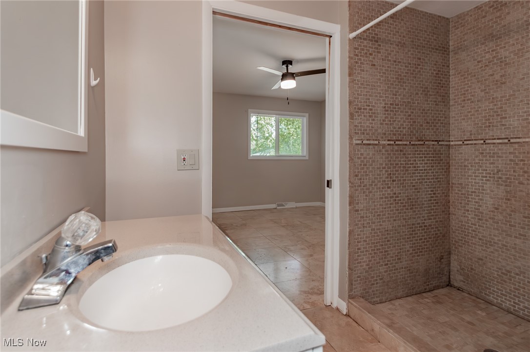 5540 Roy Road Cleveland, OH 44143 - Photo 10 of 16 Updated full bathroom featuring tiled shower stall for easy access.