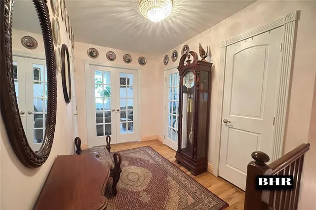 a view of a hallway with windows and stairs