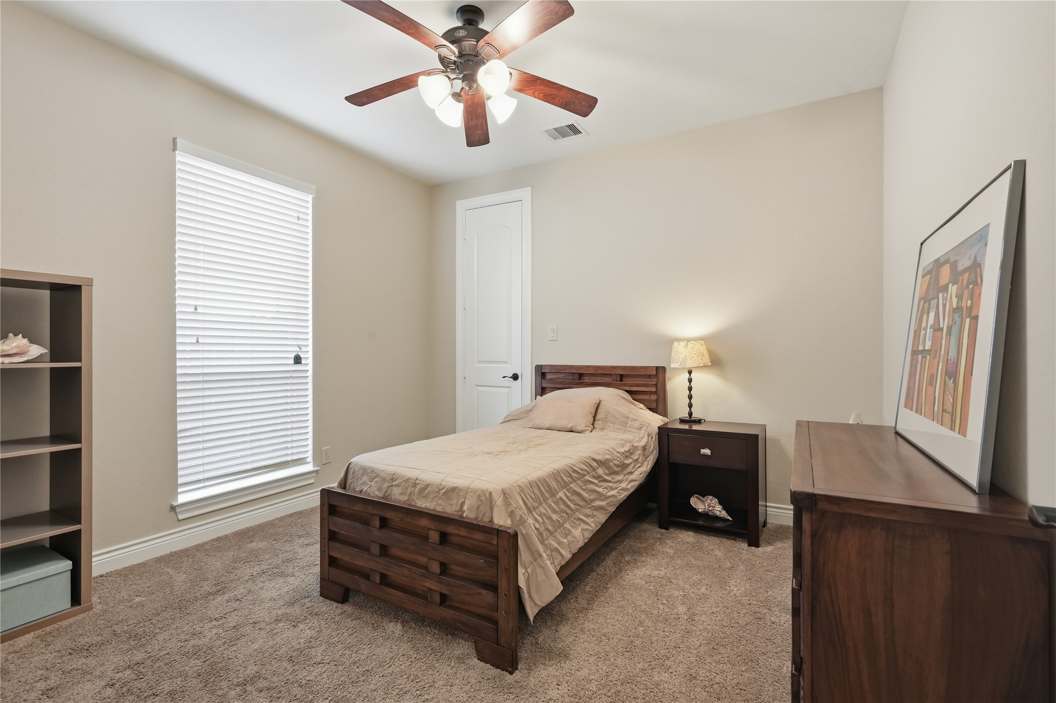 6429 Remlap Street Houston, TX 77055 - Photo 16 of 30 Comfortable first-floor secondary bedroom with a generous walk-in closet and an attached bath, creating a private suite-like feel.