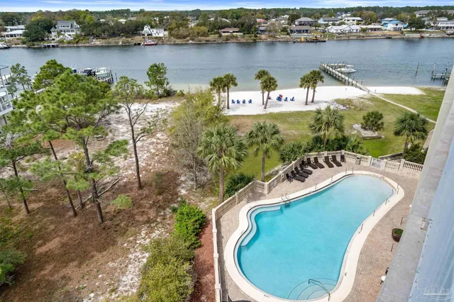 a view of a patio with table and chairs and a big yard