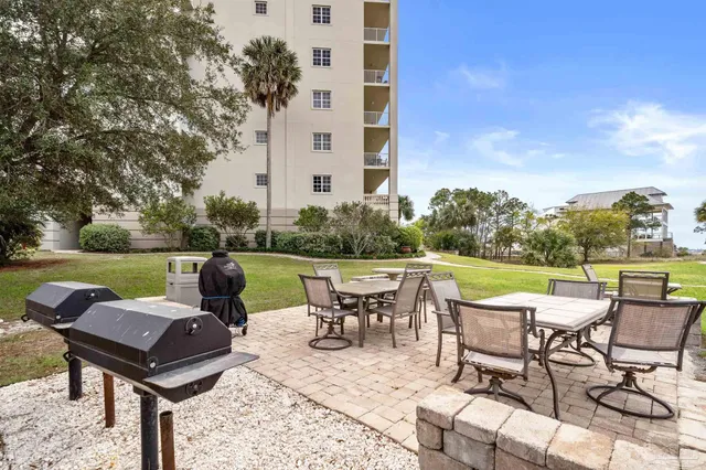 a view of a lake with houses in the back