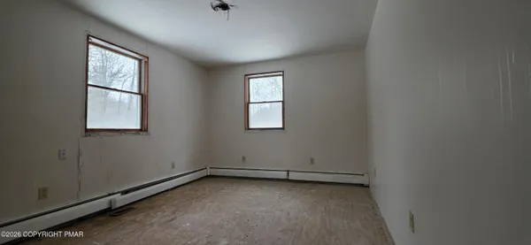 an empty room with windows