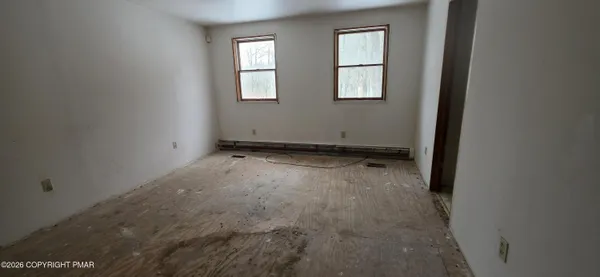 an empty room with windows