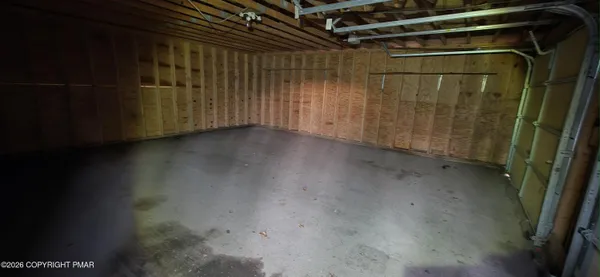 a view of a room with wooden walls