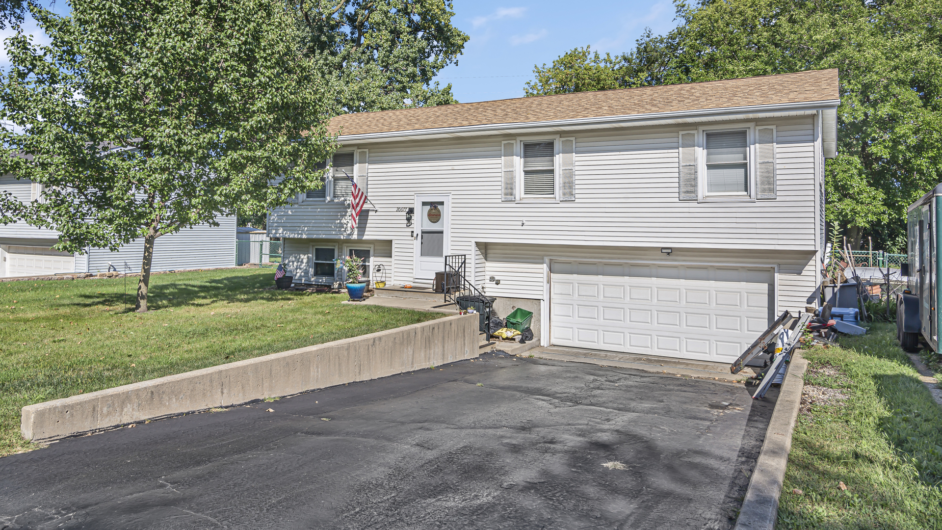 20677 Raphael Avenue Prairie View, IL 60089 - Photo 1 of 15 a view of a house with a yard and a large tree