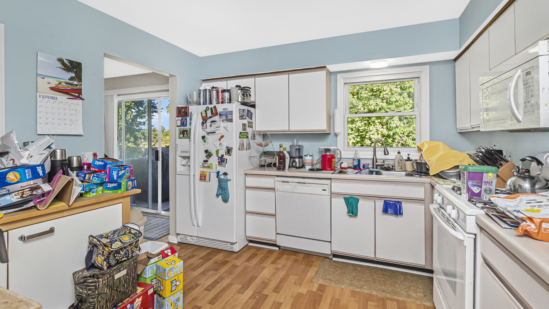 20677 Raphael Avenue Prairie View, IL 60089 - Photo 5 of 15 a kitchen with stainless steel appliances hardwood floor and window
